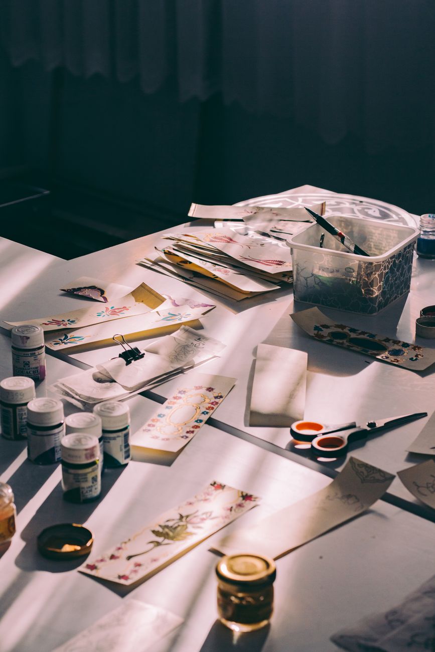 Small group working on crafts at a studio table